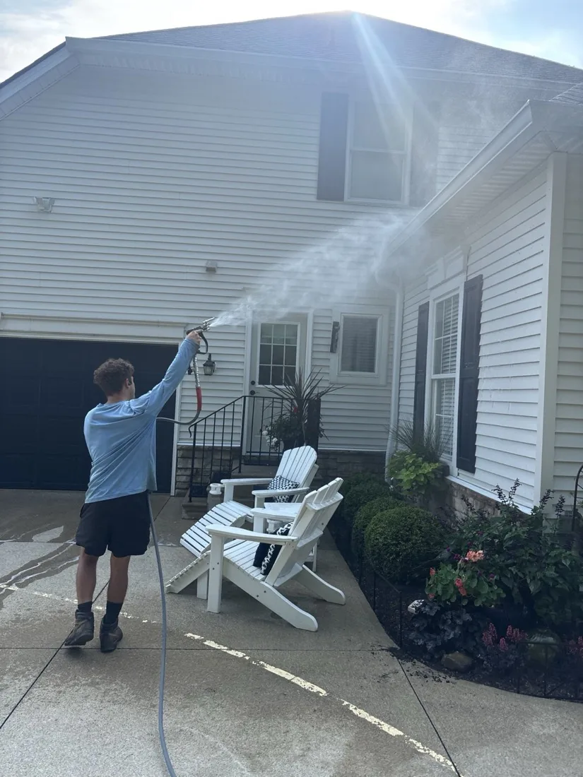 Rinsing soft-wash solution off the siding