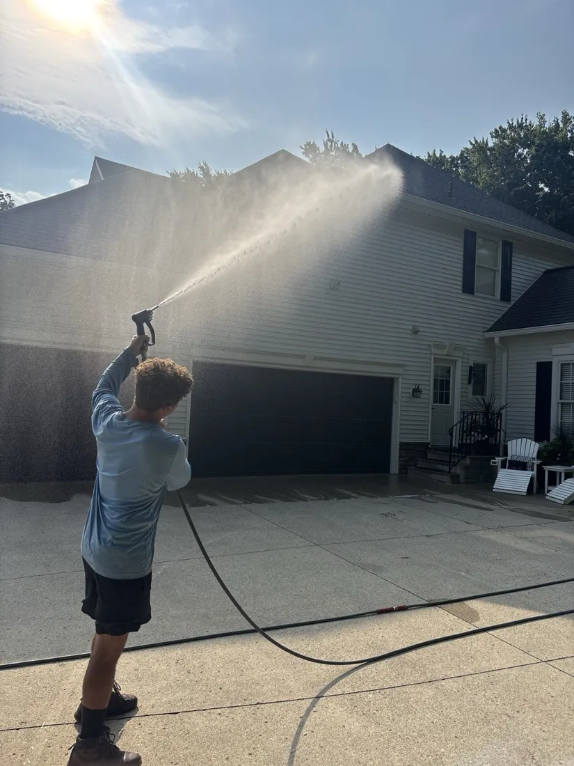 Soft washing the garage side of the house