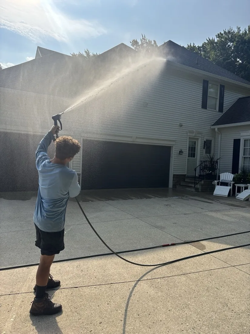 Finishing rinse on a soft-washed house exterior