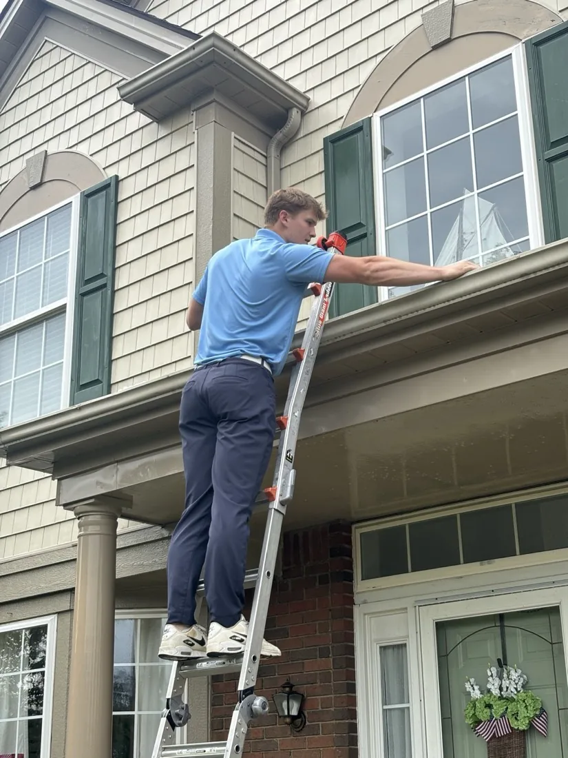 Street-level view of the ladder set for upper window cleaning
