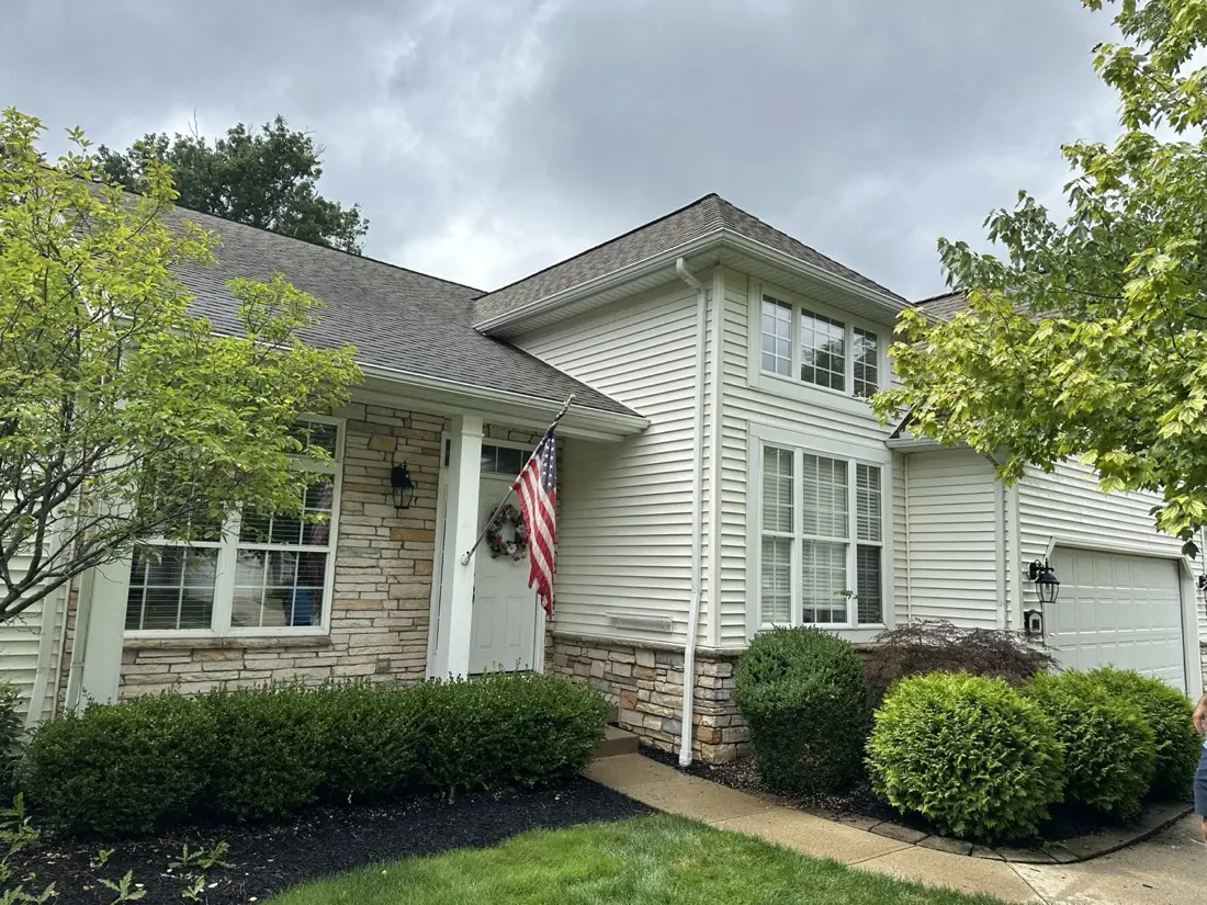 Freshly cleaned home exterior with bright siding and trim